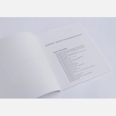 Photograph of the artist book "Let's Talk Art" by Michelle Lisa Herman, Chapter 1 view